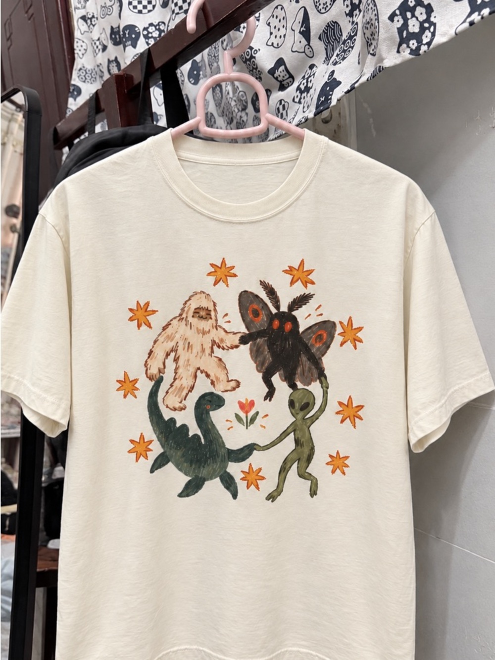 Dancing Cryptids Bigfoot Mothman Alien and Lockness Monster OffWhite T-Shirt - Picture 2 of 3